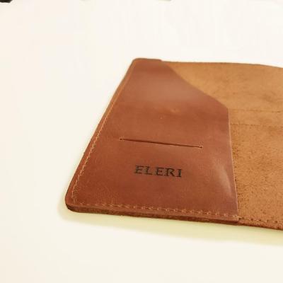 enjoythewoodestonia pressitud logoga ja graveeringuga nahast märkmikud Naiskodukaitse jaoks